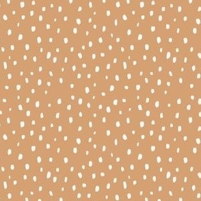 Creamy speckle marks on honey yellow