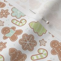 Gingerbread men and santa cookies christmas cutesie trees snowflakes candy canes and stars seasonal bakery cream lime green blue beige pastel boys