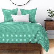 Regular white polka dot print on aqua