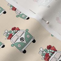 Happy holidays colorful Christmas camper van hippie bus with presents driving home for Christmas vintage mint green red on cream beige