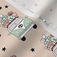Happy holidays colorful Christmas camper van hippie bus with presents driving home for Christmas vintage starry night mint green blush pink on tan