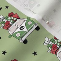 Happy holidays colorful Christmas camper van hippie bus with presents driving home for Christmas vintage starry night mint green red on matcha