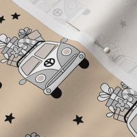 Happy holidays colorful Christmas camper van hippie bus with presents driving home for Christmas vintage starry night beige tan gray neutral pastel palette