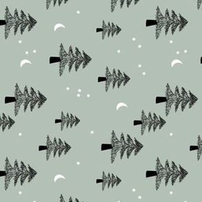 Boho Christmas forest with pine trees moon and stars winter night black on sage green rotated 