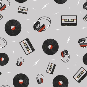 Headphones, Vinyl records and Mix Tapes on Gray Background