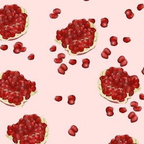 Juicy pomegranate on a pink  background