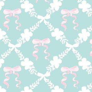 A hand illustrated  ribbon bow and floral leaves on mint