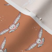 Cute freehand minimalist owl design woodland fall animals for kids boho style pink blush on burnt orange