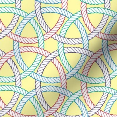 large colorful interlocking rope rings on pale yellow  (crayonrainbow)