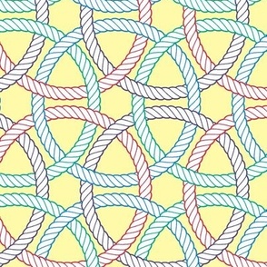 large colorful interlocking rope rings on pale yellow  (crayonrainbow)