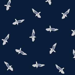 Tiny Seagulls Birds Flying against  dark Blue sky