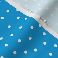 Scattered Polka Dots on Blue