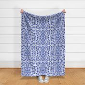 Symmetrical floral folk art pattern in indigo blue and white - middle scale