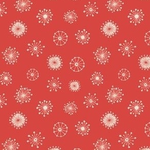 Delicate white snowflakes on a red background