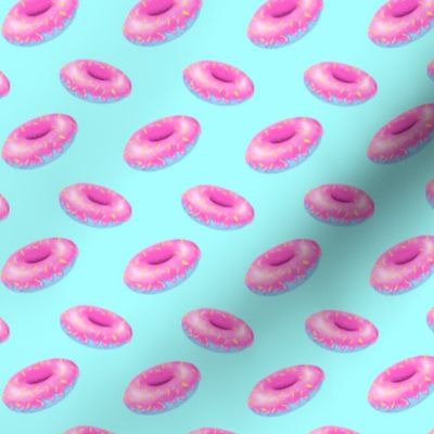 Pink and blue donuts on light blue