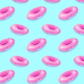 Pink and blue donuts on light blue