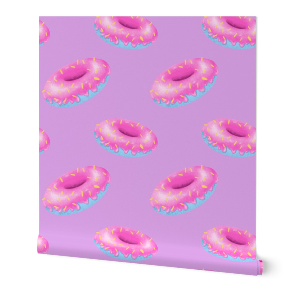 Pink and blue donuts on purple