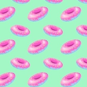 Pink and blue donuts on mint