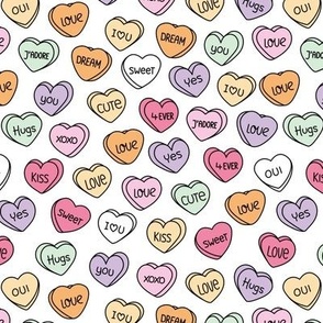 Sweet pop sugar candy hearts for valentine - cutesy love snacks vintage style nineties lilac pink yellow orange on white