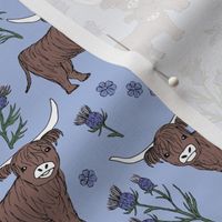 Sweet cutesy highland cows in a lush spring garden -  longhorn and thistles ranch design for kids wild animal design lilac violet green on periwinkle blue