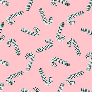 Green And White Candy Canes On Pink