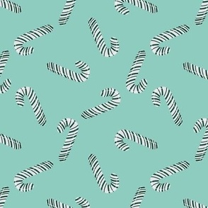 Green And White Candy Canes On Turquoise