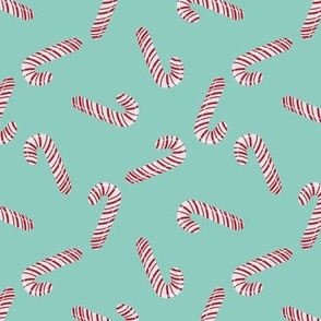 Red And White Candy Canes On Turquoise