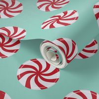 Red And White Peppermint Candy On Turquoise