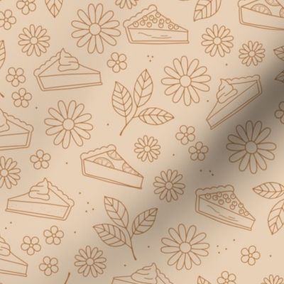 Boho style cheesecake carrot cake and pumpkin pie - leaves and daisy flowers thanksgiving food brown on tan beige
