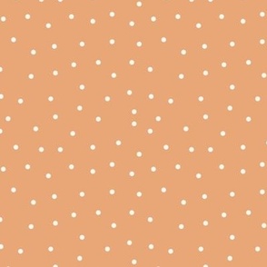 Dots spots off white on orange/peach background