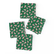 Small Scale Christmas Tree Frosted Snack Cakes on Emerald Green