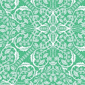 Bright green cut paper intricate floral pattern on white - large