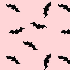 Black bats on pale pink background. Halloween pink fabric with bats. Halloween wallpaper