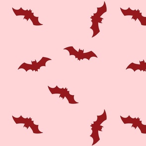 Red bats on pale pink background. Halloween pink fabric with bats. Halloween wallpaper