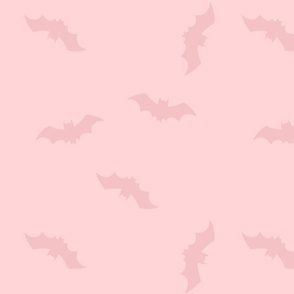 Pink bats on pale pink background. Halloween pink fabric with bats. Halloween wallpaper