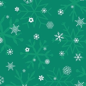 White snowflakes on emerald green, Christmas holidays, New Year decor