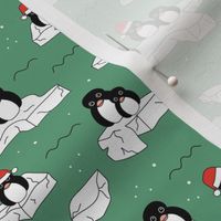 Santa christmas penguins on melting pieces of ice winter ocean ice cap animals design jade green