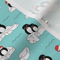 Santa christmas penguins on melting pieces of ice winter ocean ice cap animals design teal blue