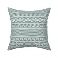 White knitted  Nordic stitches on light blue texture, small