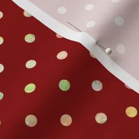 Golden and yellow polka dots on a red background