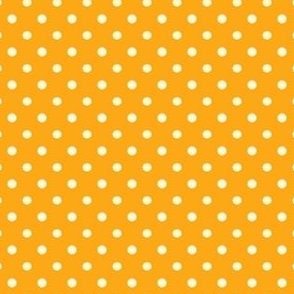 Polka dot fabric in spring palette in light orange and light yellow