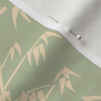 Minimalist bamboo leaves on warm green