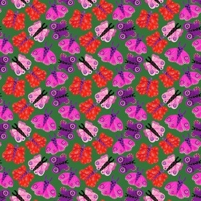    Bright pink purple red butterflies on a green background.