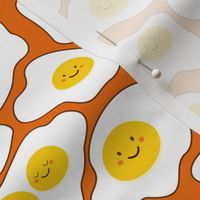 Funny omelettes with smiling happy faces 