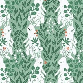 white rabbits among the plants