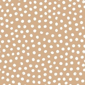 Snowflakes, snowballs or simple dots - on gold brown