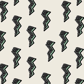 Comic retro style electric lightening bolt and thunder storm lit pop art style eighties kids print neon mint black on ivory polka dots