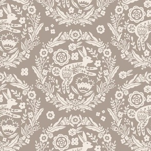 Folk Art Bunny and Floral Wreath in white on a taupe background