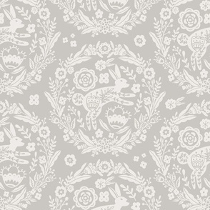 Folk Art Bunny and Floral Wreath in white on a warm grey background