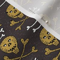 golden and white skulls and crossbones on dark brown | small